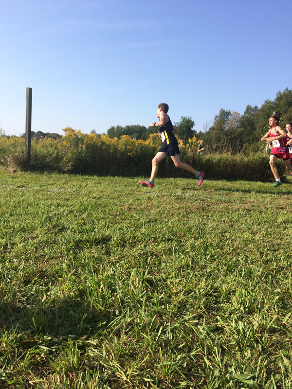 Manistee Chippewas Boys and Girls Cross Country Team on course running