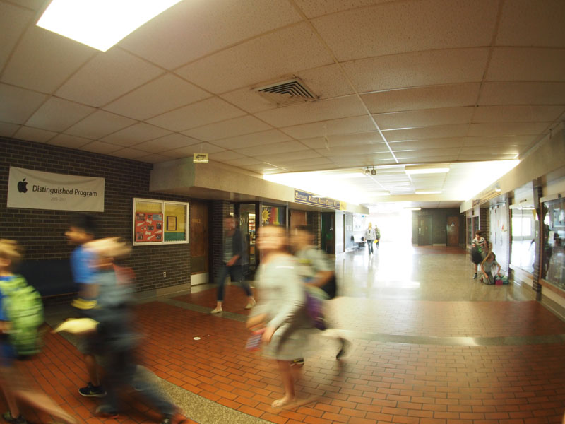 students walking through kennedy hallway