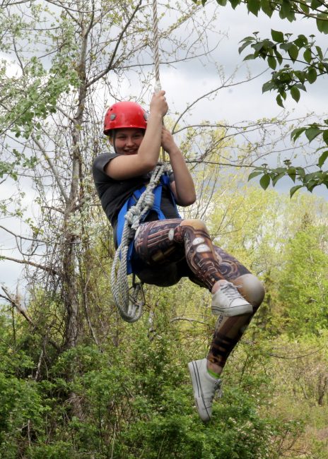 Student swinging on rope at Adventure Learning