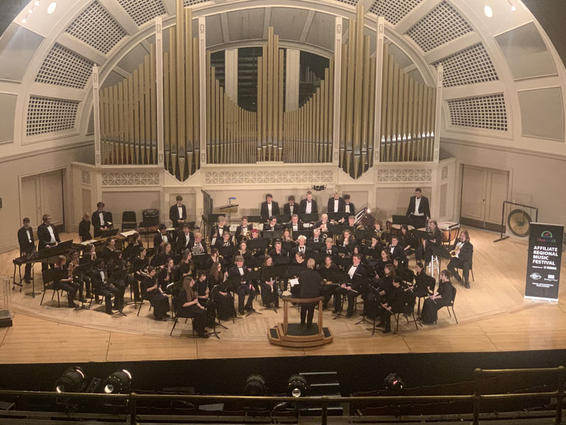 MHS Band performing on stage at Great Lakes Concert Band Festival