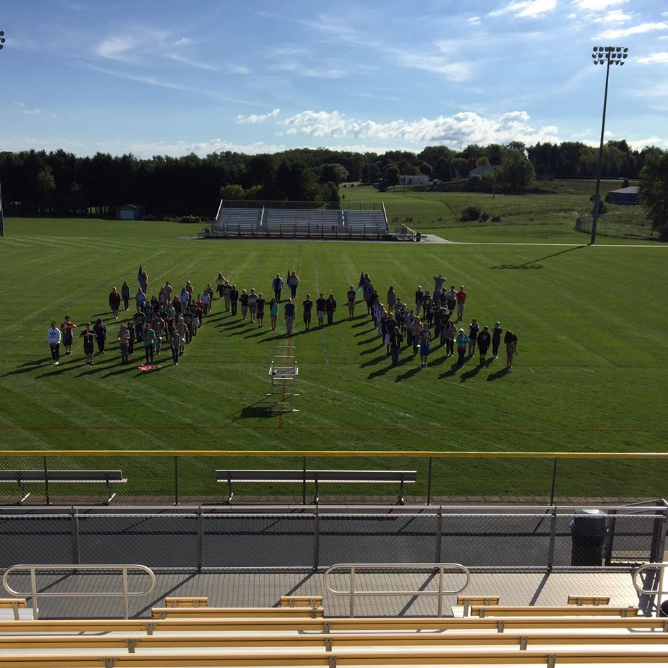 Band in M formation on football field
