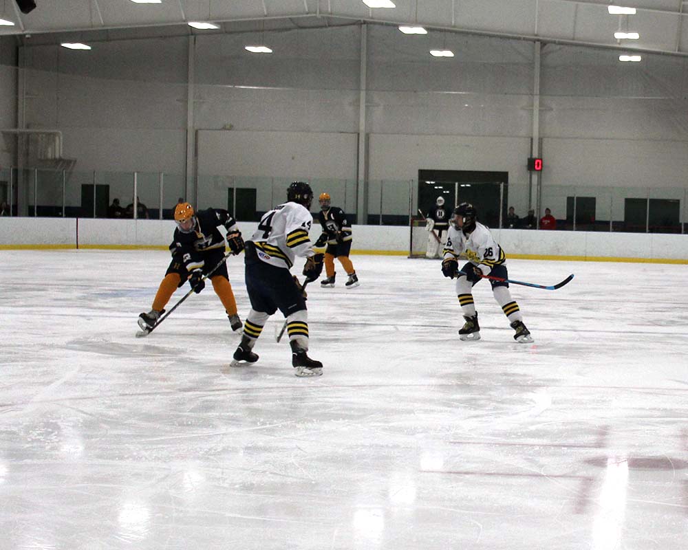 Manistee Chippewas Hockey team on ice playing game