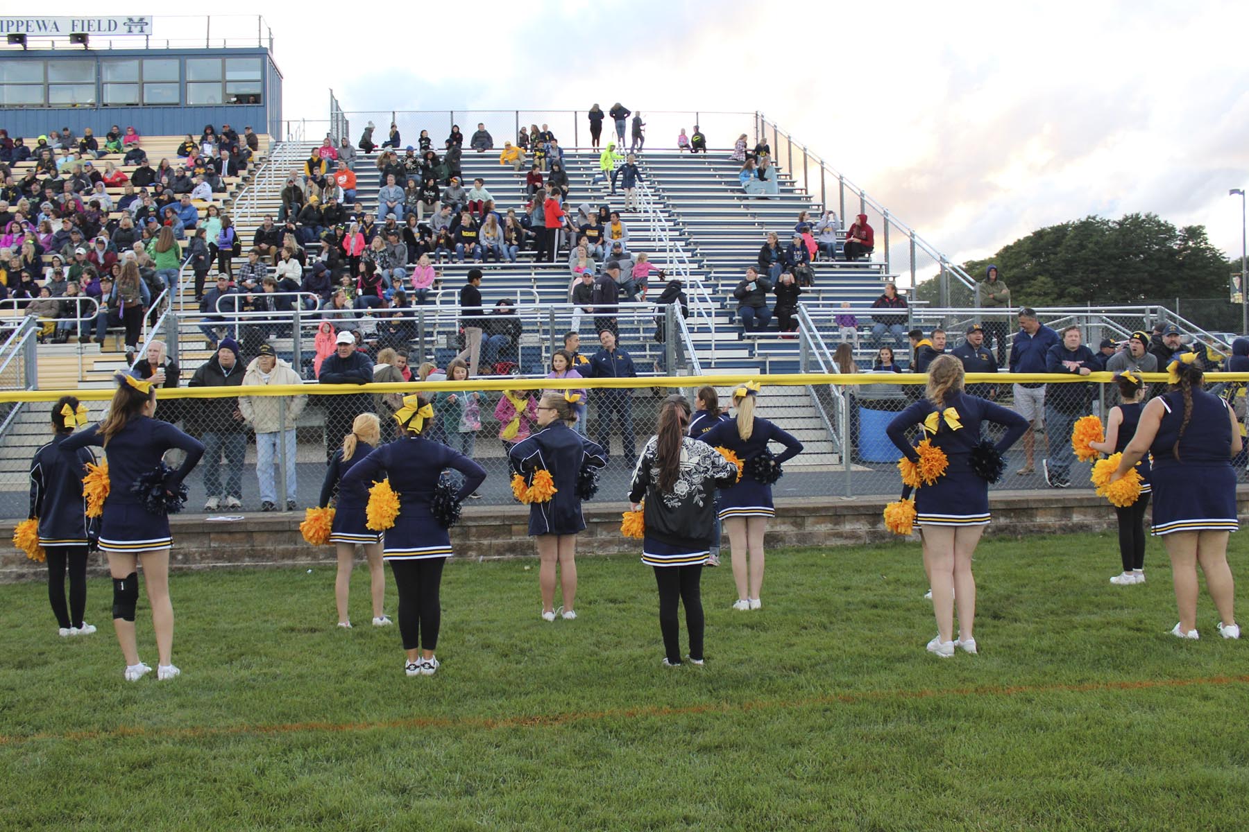 MMHS students cheering at High School football game