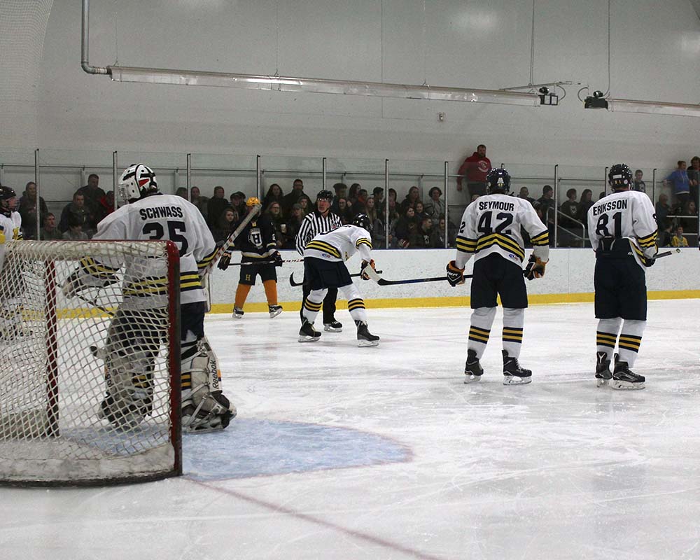 Manistee Chippewas Hockey team on ice playing game