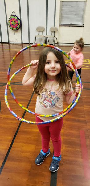 Student with two hula hoops