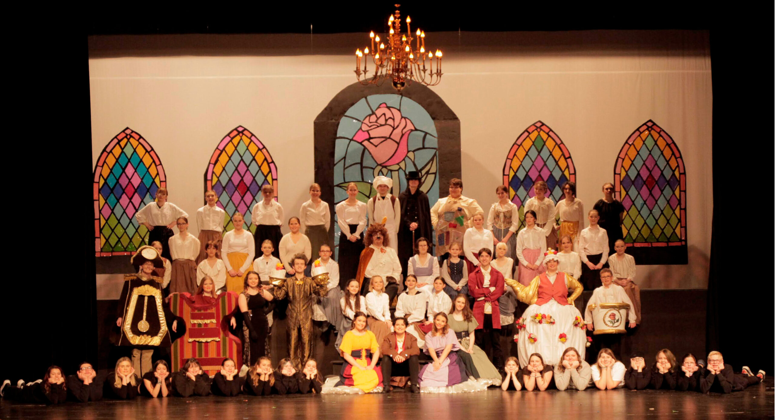 Students posing on stage