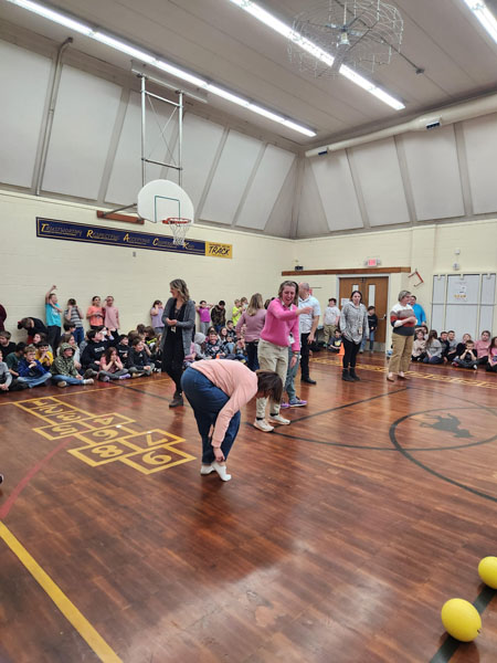 Students and teachers play dodgeball at Kennedy