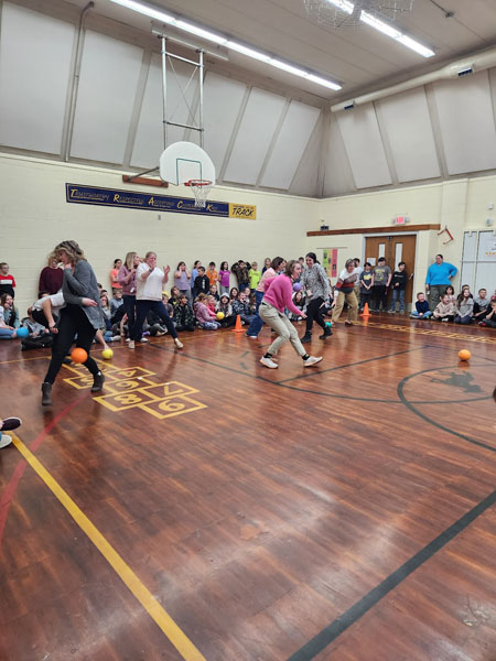 Students and teachers play dodgeball at Kennedy