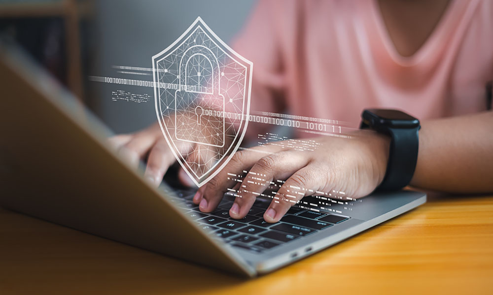 Cybersecurity Concept, Child Using Laptop With Digital Lock Shield Icon, Online Data Protection And Internet Safety Student using a laptop with cyber security graphic overlay